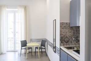 Fridge, cookware/dishes/utensils, dining tables