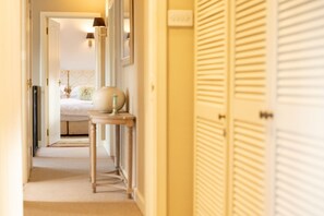 Enter a serene space with a comfortable bed and stylish decor.