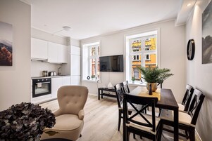 Family Apartment, 3 Bedrooms, Ground Floor | Living area | Flat-screen TV