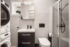 Shower, hair dryer, heated floors, towels