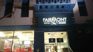 The exterior of the Fairmont Hotel with a sign indicating the presence of a restaurant. - Fair Mont (Multan)
