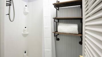 Shower, hair dryer, towels, shampoo