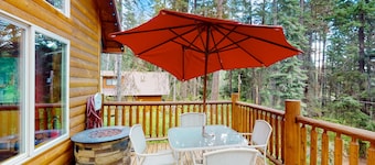 Three-story, dog-friendly home with a private hot tub, firepit, & wood stove