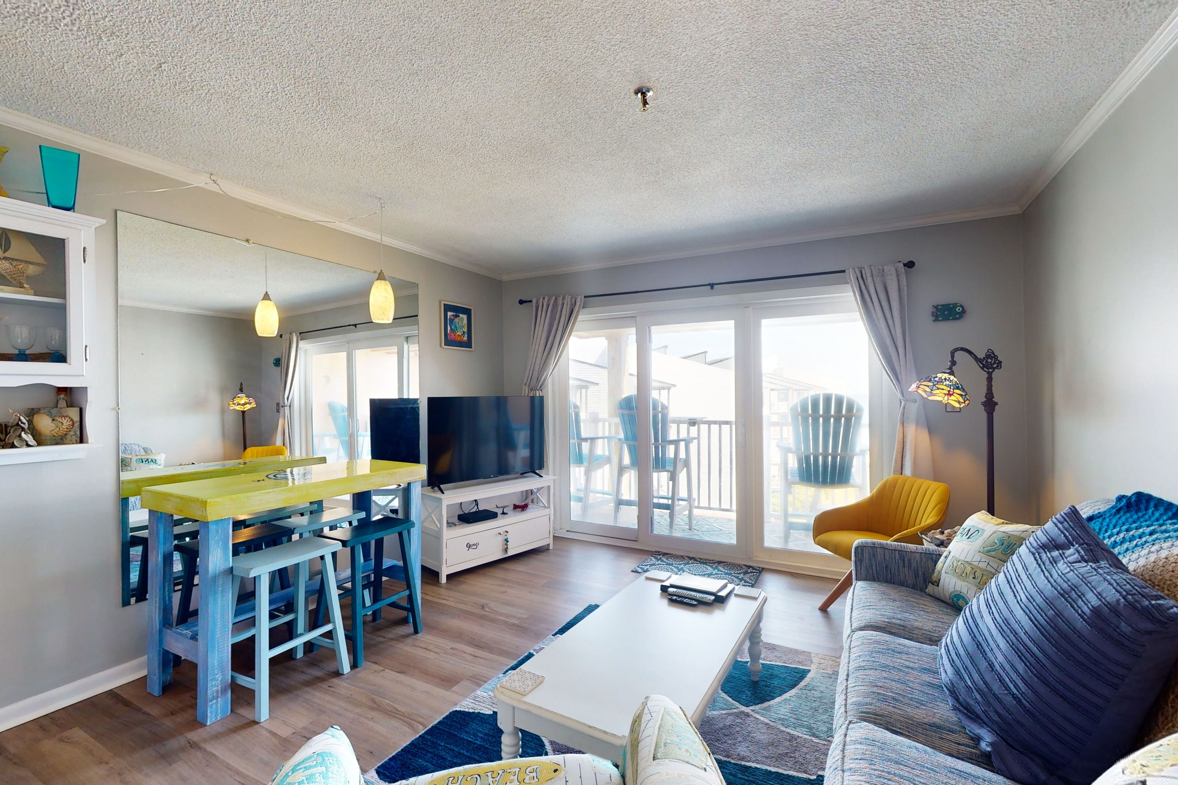 Beach-view condo near the beach with outdoor pool, balcony, W/D, central AC