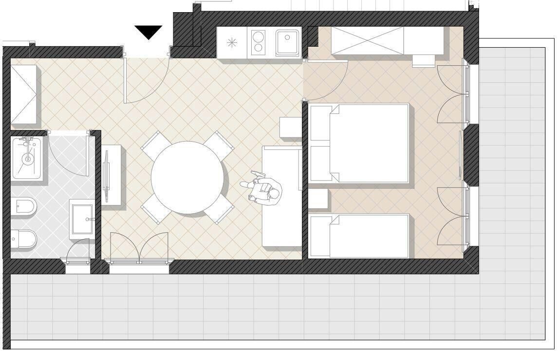 Plano de un cuarto de hotel que incluye una cama, un baño pequeño, una kitchenette y un comedor.