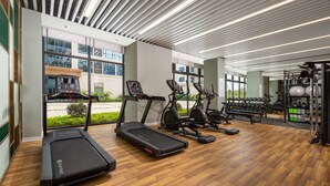A modern gym with treadmills, stationary bikes, and weight equipment. - Hilton Garden Inn Guangzhou Airport Aerotropolis (Guangzhou)