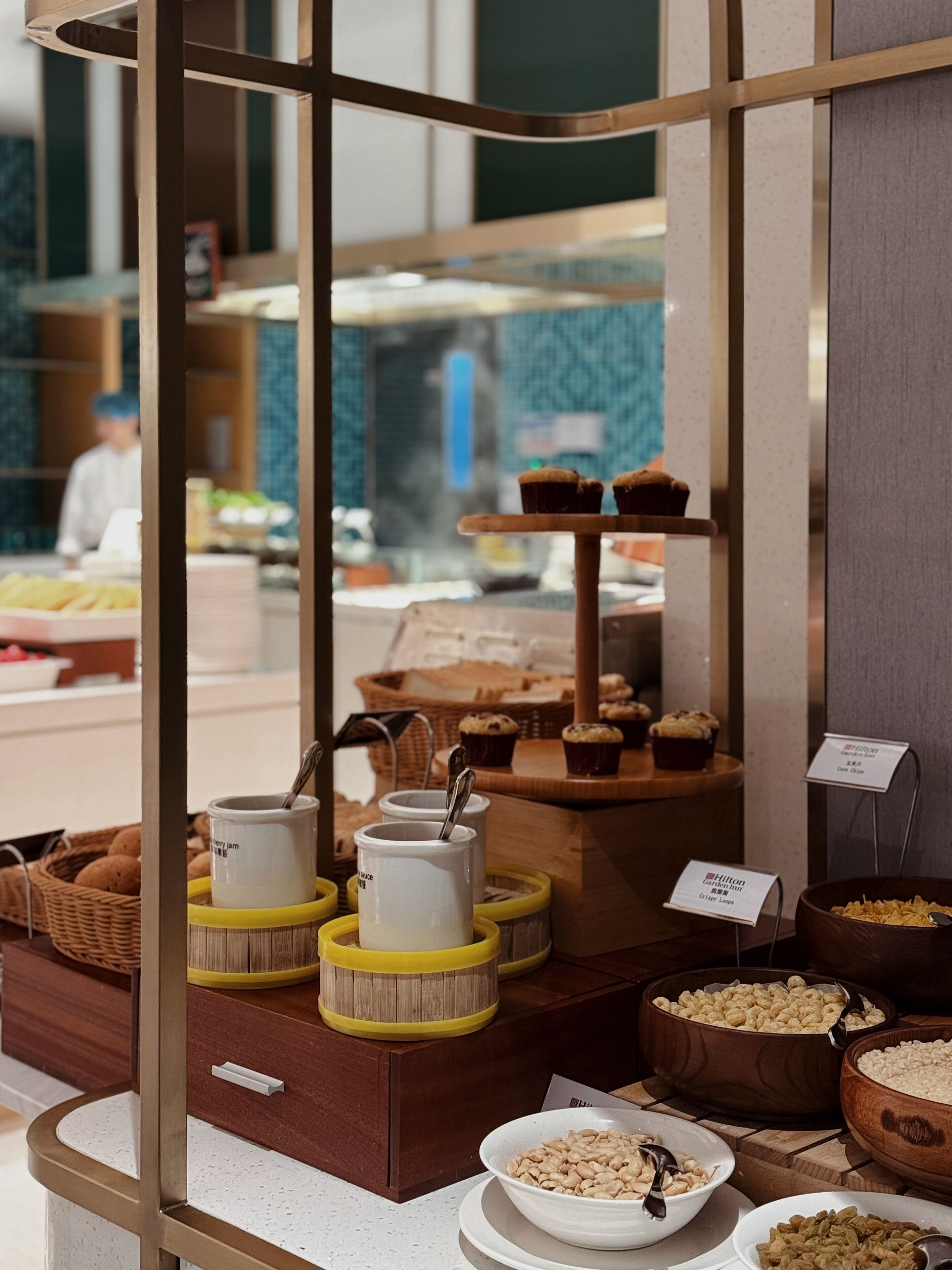 A breakfast buffet with various food items and condiments.