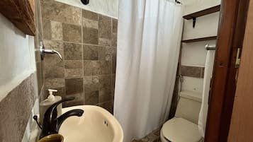 Bidet, towels, soap, toilet paper