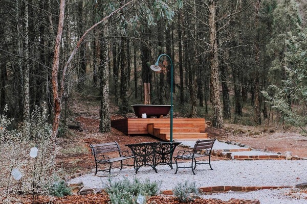 A patio out the back provides ample space outdoors to dine or dry off in the sun after a dip in the bath.
