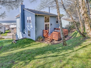 A single-story house with a front deck and a small porch.