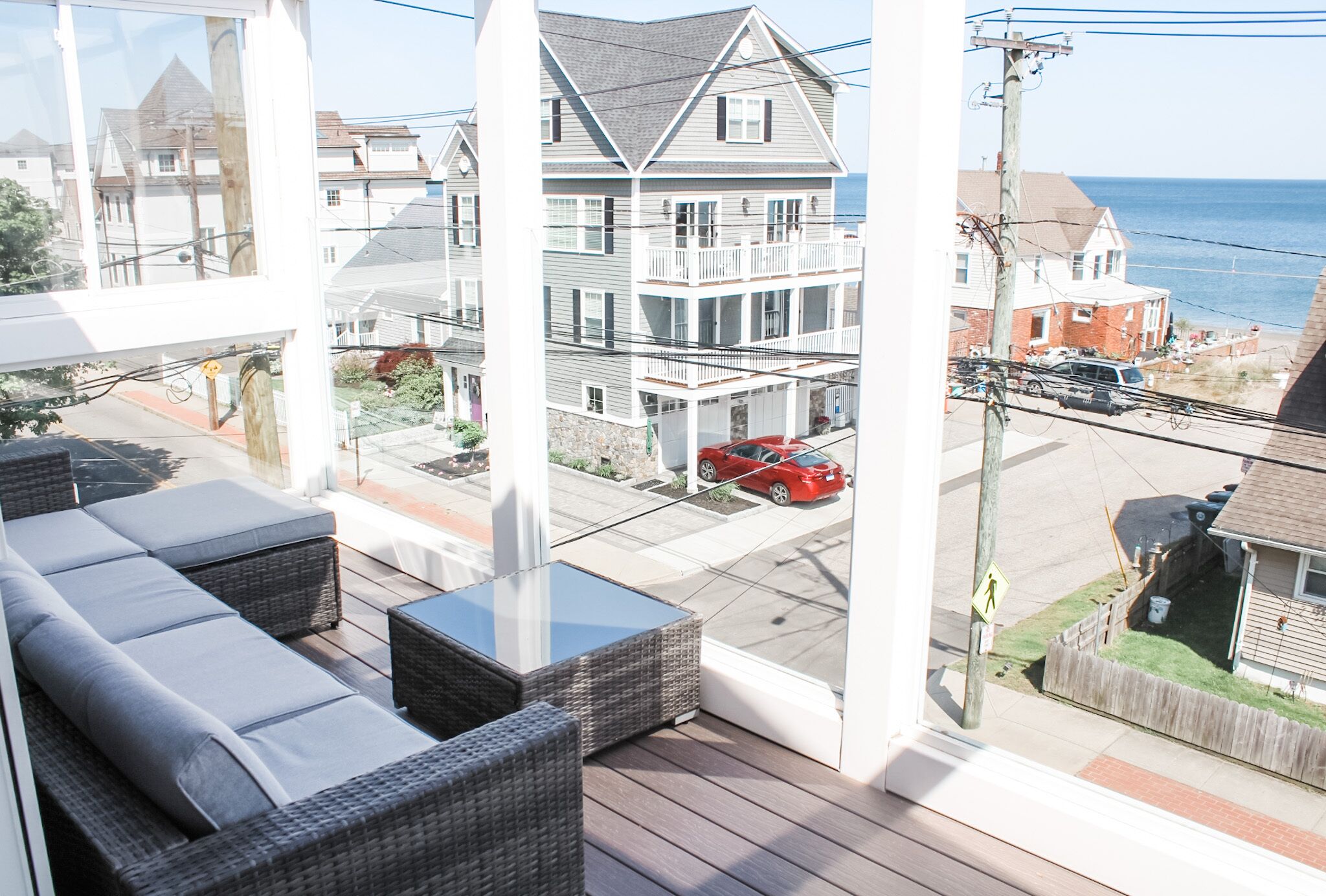 Enjoy lounging after a long beach day on the sectional looking out at the water