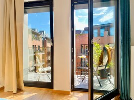 Standard Apartment, 1 Bedroom, Balcony, City View | Living area | 43-inch Smart TV with satellite channels