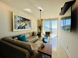 Luxury Apartment, Sea View (Camino al mar) | Living area | Flat-screen TV - Camino al Mar (Mazatlán)