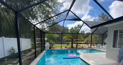 Waterfront Paradise w dock, large patio, lanai, pool, hot tub! Bring your boat!
