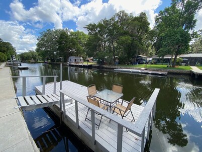 Waterfront Paradise w dock, large patio, lanai, pool, hot tub! Bring your boat! 