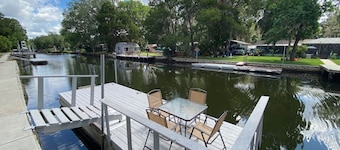 Waterfront Paradise w dock, large patio, lanai, pool, hot tub! Bring your boat!