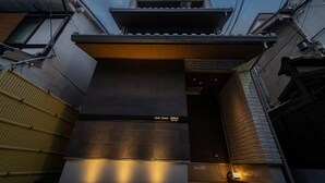 A hotel entrance with a modern design, a sign indicating 'Hotel Liberté', and a visible entrance door. - Hotel Liberte Kyoto Gojo (Kyoto)