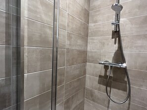Combined shower/bathtub, hair dryer