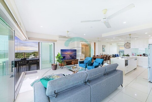 Premier Condo | Living area | 55-inch Smart TV with cable channels, TV, Netflix
