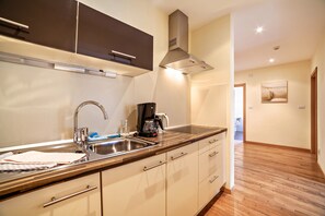 Fridge, microwave, stovetop, coffee/tea maker