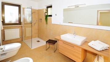 Bathtub, hair dryer, towels