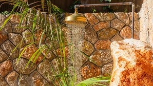 A stone wall with a showerhead. - Villa Puerto Apartment with Mountain Views, Pool, and Wi-Fi (Sóller)