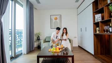Deluxe Apartment | Living area | 32-inch Smart TV with cable channels, TV, printers