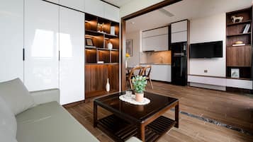 Deluxe Apartment | Living area | 32-inch Smart TV with cable channels, TV, printers