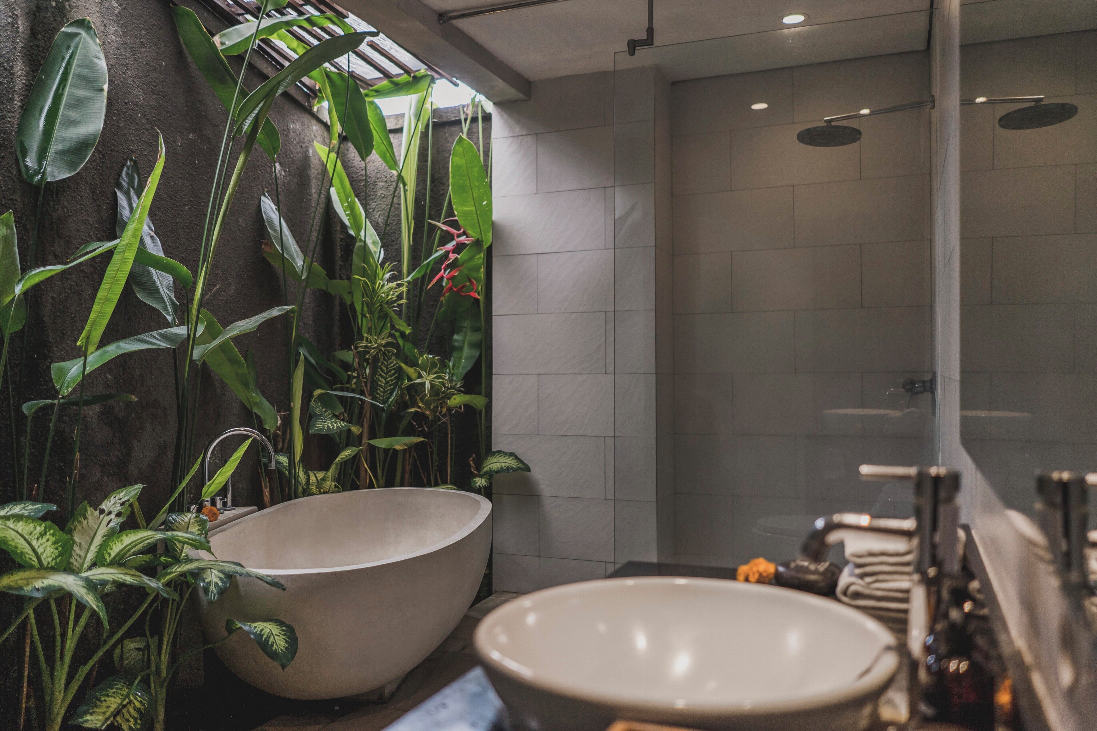 Separate bathtub and shower, rainfall showerhead, designer toiletries
