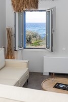 Apartment, 1 Bedroom | Living area | 50-inch flat-screen TV with digital channels, TV