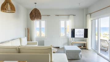 Apartment, 1 Bedroom | Living area | 50-inch flat-screen TV with digital channels, TV