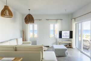 Apartment, 1 Bedroom | Living area | 50-inch flat-screen TV with digital channels, TV