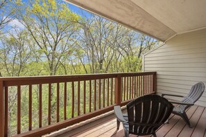 Relax on the deck with Adirondack chairs, taking in the serene views of the surrounding landscape.