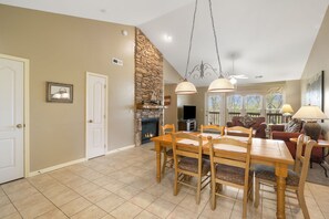 Enjoy meals in this elegant dining area with a large wooden table and six comfortable chairs.