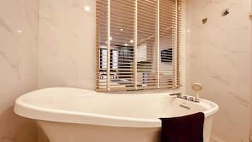 Premium Studio | Bathroom | Shower, hair dryer, slippers, towels
