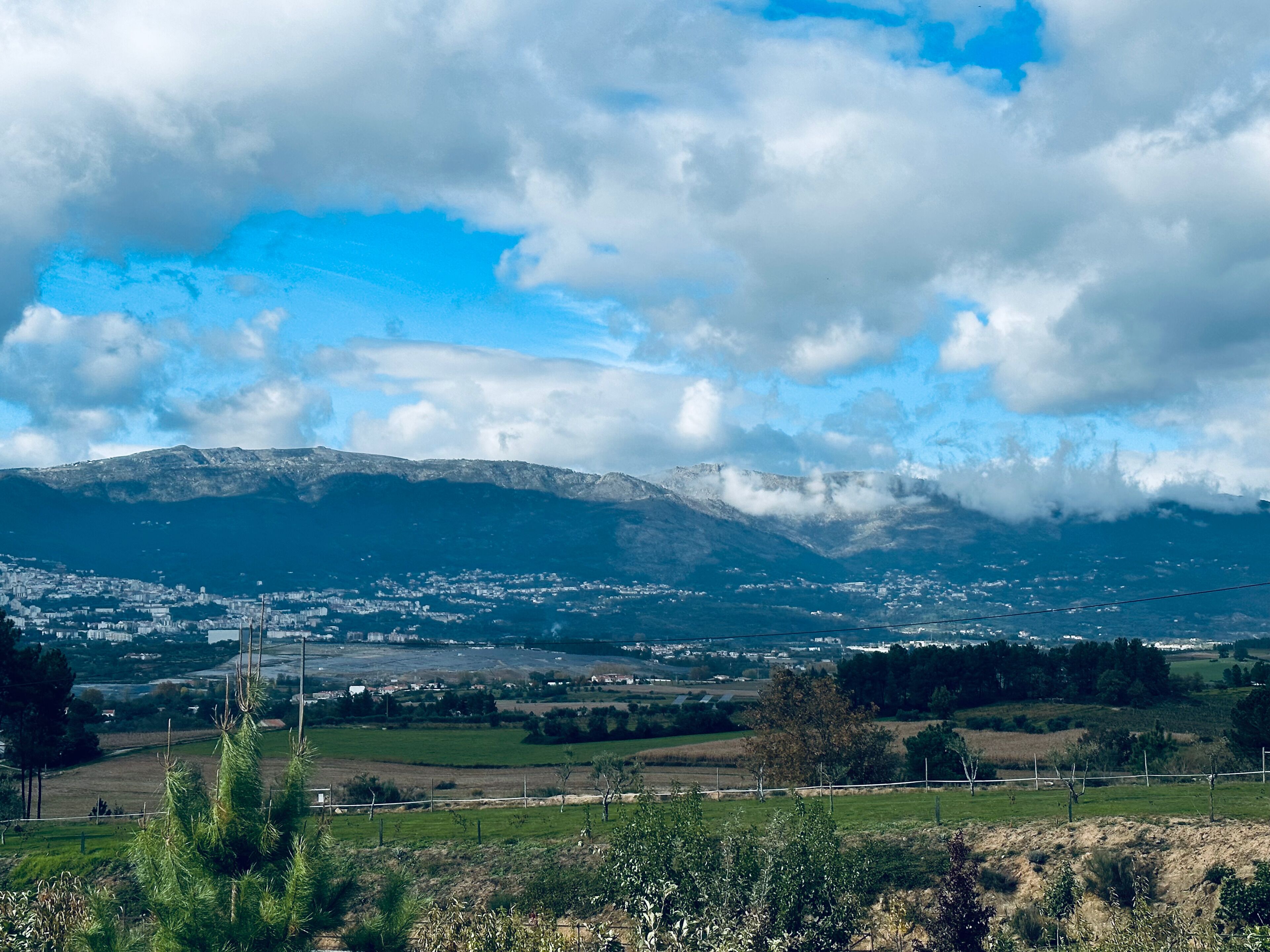 A mountainous landscape with a town in the valley.