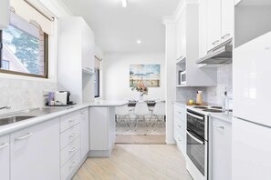 Microwave, stovetop, toaster, cookware/dishes/utensils