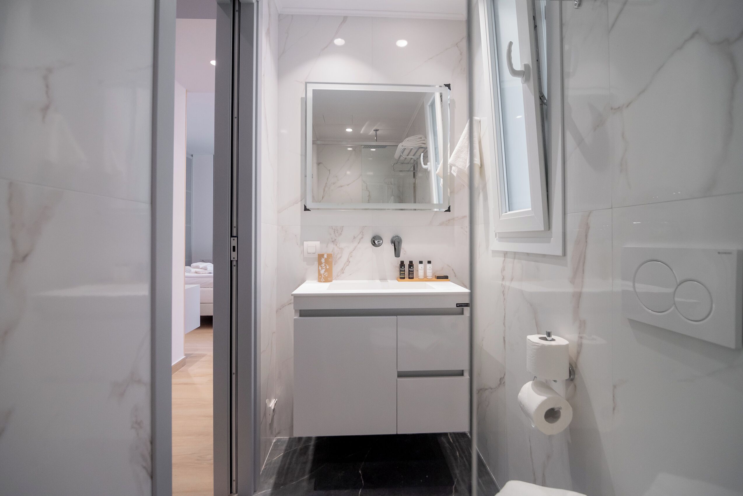 deluxe studio | bathroom | shower, rainfall showerhead, designer toiletries, hair dryer