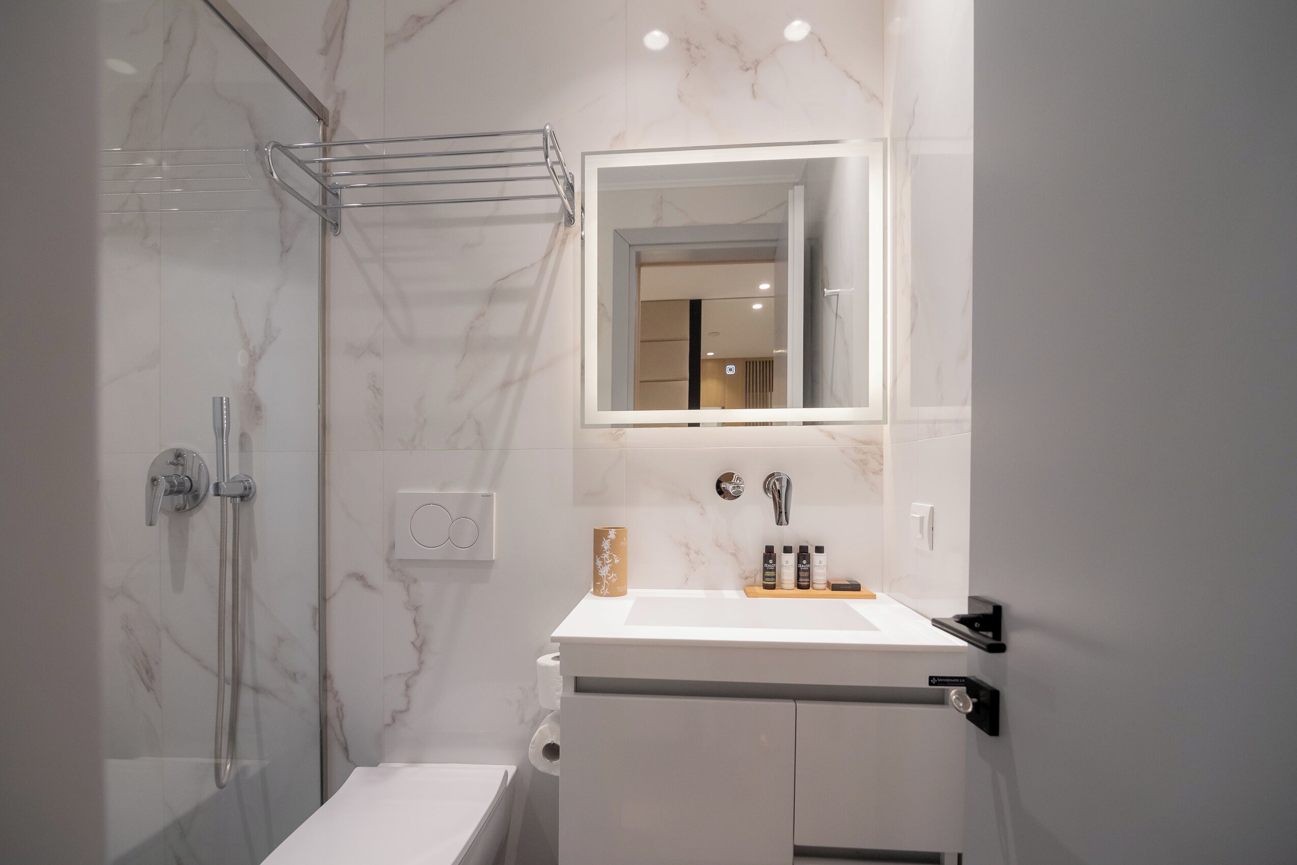 deluxe double room | bathroom | shower, rainfall showerhead, designer toiletries, hair dryer