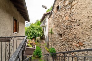 Stroll through historic streets lined with traditional stone buildings and charming balconies.