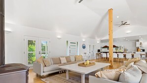 A modern living room with a sofa, coffee table, and a fireplace. - Ultimate family retreat, on the Portsea / Sorrento border, (sleeps 15/16) (Portsea)