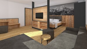 A modern hotel room with a wooden accent wall, a flat-screen TV, a bed with white bedding, a sofa, and a small round table. - Eibinghof Bed & Breakfast (Saalbach-Hinterglemm)