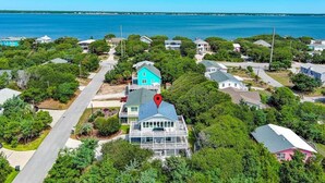 A coastal residential area with houses surrounded by greenery and a view of the ocean. - Emerald Isle Lookout, Oceanview House in Emerald Isle, NC! (Emerald Isle)