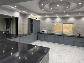 Enjoy cooking in this well-equipped kitchen with a microwave and ample counter space.