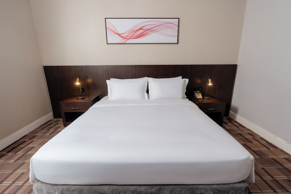 Premium bedding, pillow-top beds, minibar, laptop workspace