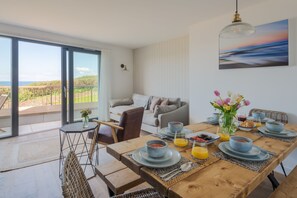 Enjoy breakfast at the dining table with a view of the outdoors.