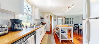 Beach-view home with beach access, deck, grill, 2 kayaks, & AC