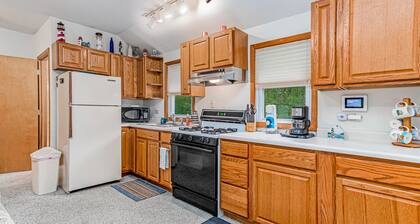 Charming home with sunroom, large yard, full kitchen, & washer/dryer