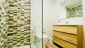 Bathtub, hair dryer, soap, shampoo