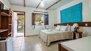 A bedroom with a bed, a nightstand, a window with curtains, a ceiling fan, and a view of the outside. - Pousada Galeão Santa Anna (Maraú)